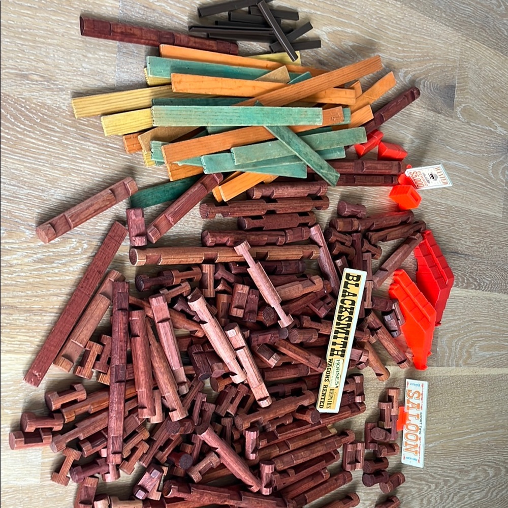 Lincoln Log pieces. Vintage. Assortment of sizes, signs, roof pieces, etc.